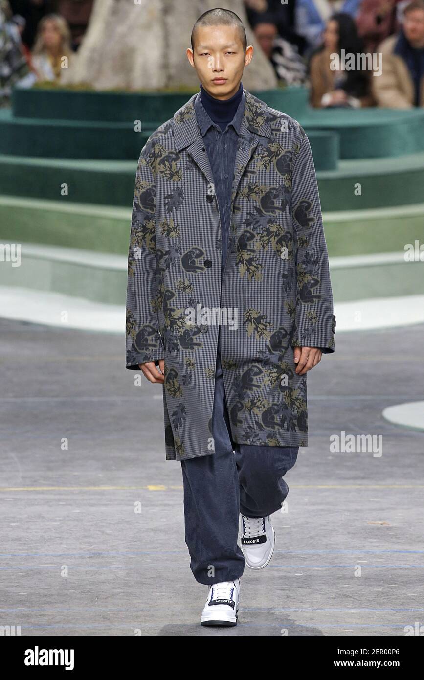Model Xu Meen walks on the runway during the Lacoste Fashion Show during  Paris Fashion Week