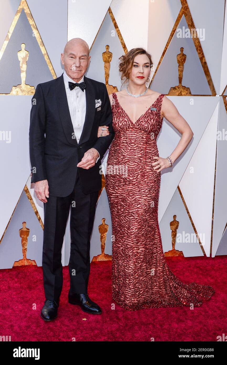 Patrick Stewart And Sunny Ozell Walking On The Red Carpet During The 