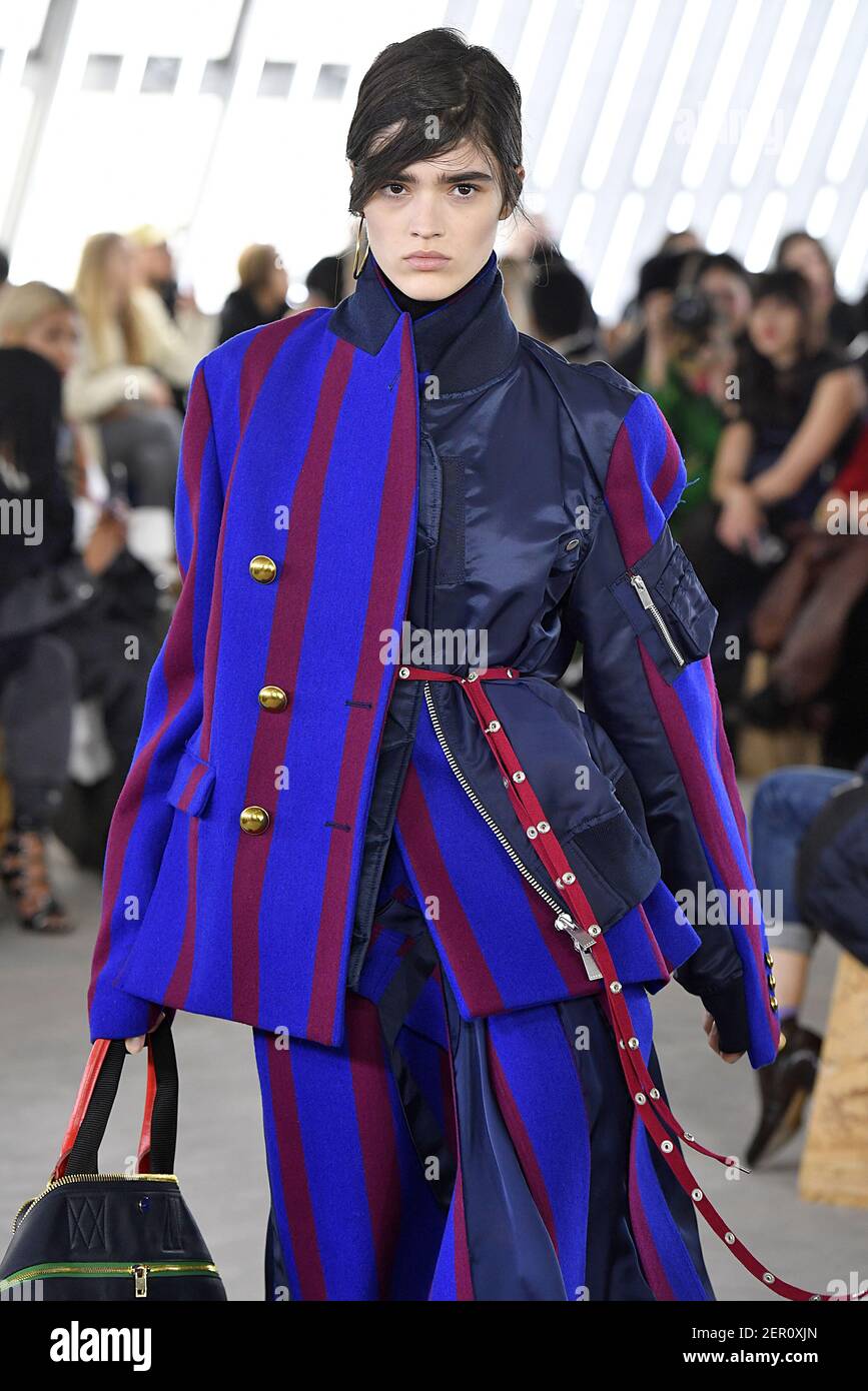 Model Alexandra Micu walks on the runway during the Sacai Fashion Show  during Paris Fashion Week