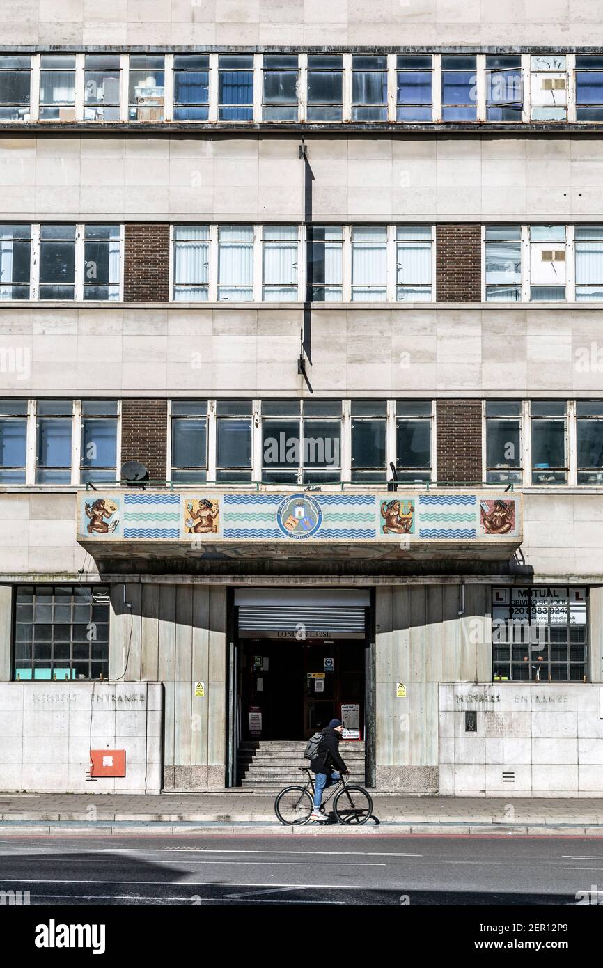 Exterior of 1930s art deco style Olympic Park campus of Global Banking School (GBS) (formelry Poplar Town Hall) on Bow Road, Tower Hamlets, London, UK Stock Photo