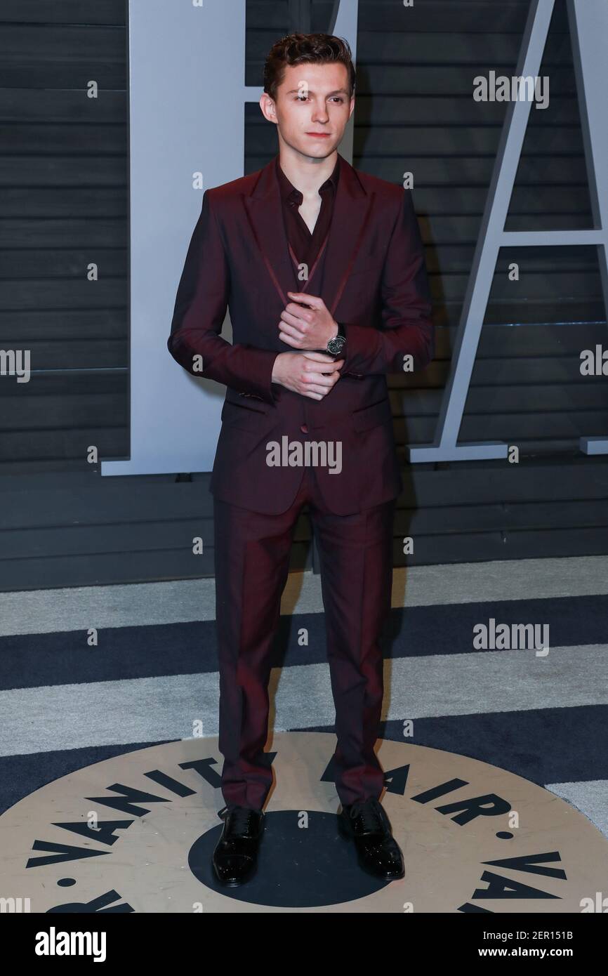 Tom Holland walking on the red carpet at the 2018 Vanity Fair Oscar