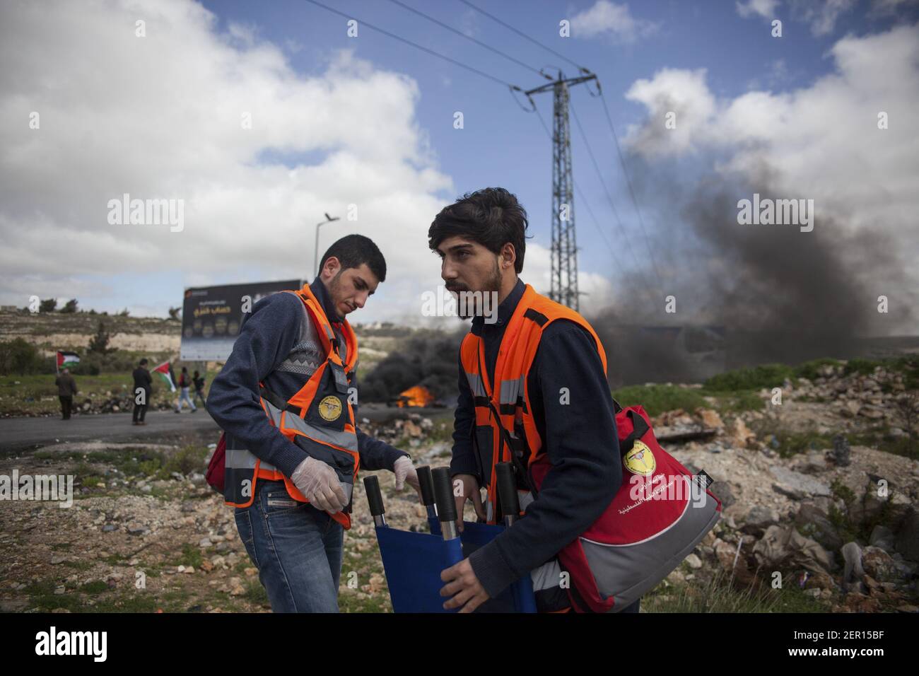 Palestinian Medical Relief Society volunteers prepare a stretcher