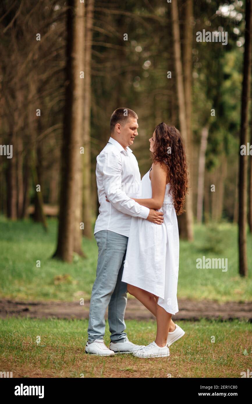 Teenage couple hugging in park hi-res stock photography and images - Alamy