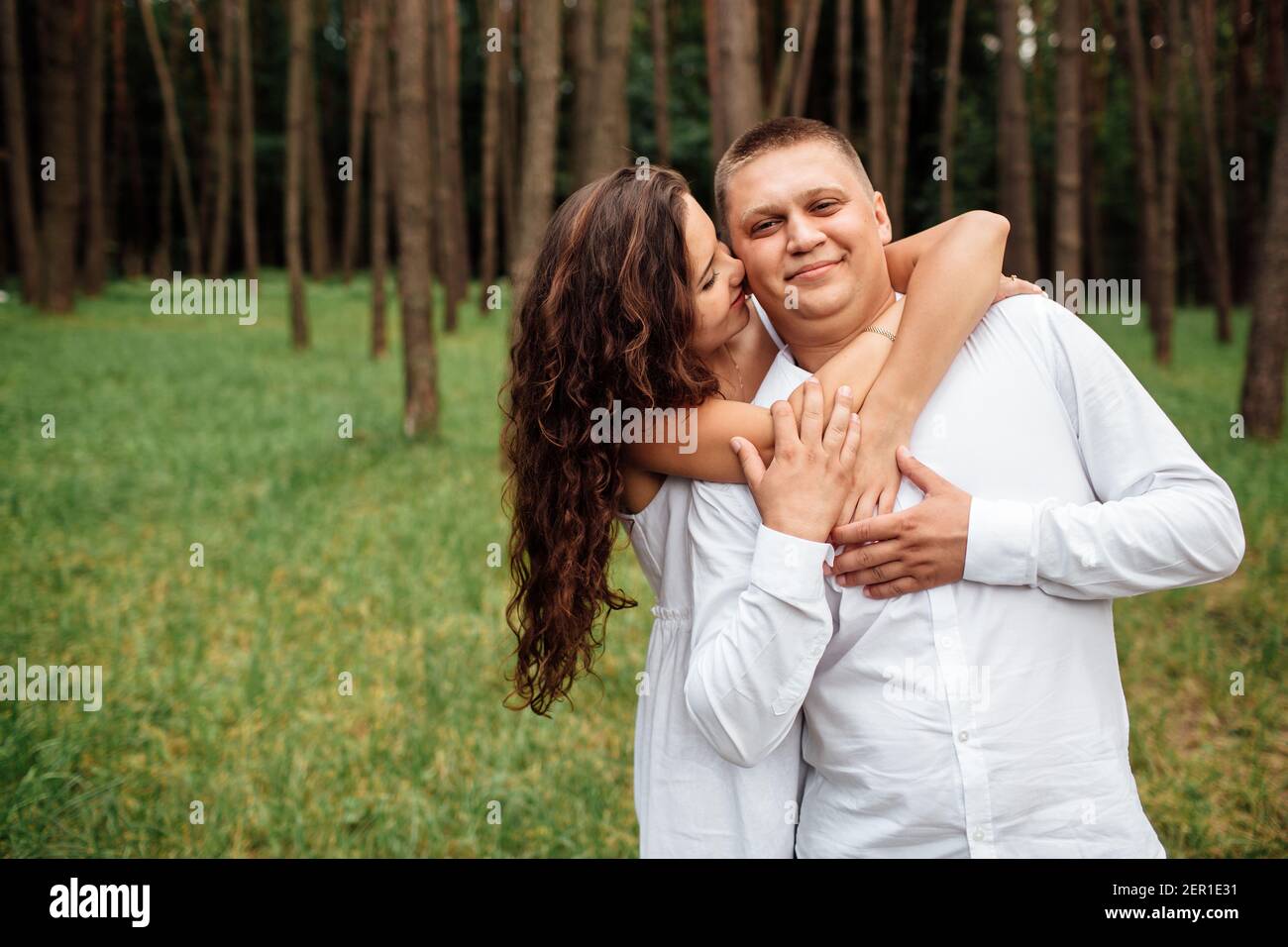 Teenage couple hugging in park hi-res stock photography and images - Alamy