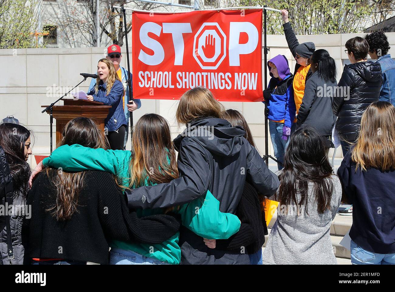 Local students look on while Druid Hills High School junior Anabette
