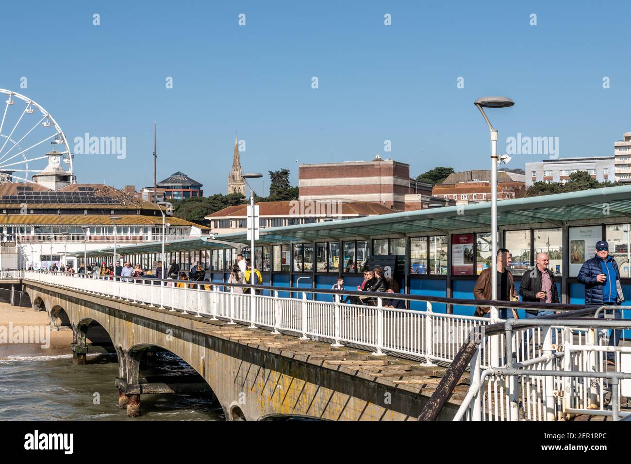 Bournemouth, UK. Sunday 28 March 2021. Crowds of people on Bournemouth beach with some social distancing. Credit: Thomas Faull/Alamy Live News Stock Photo