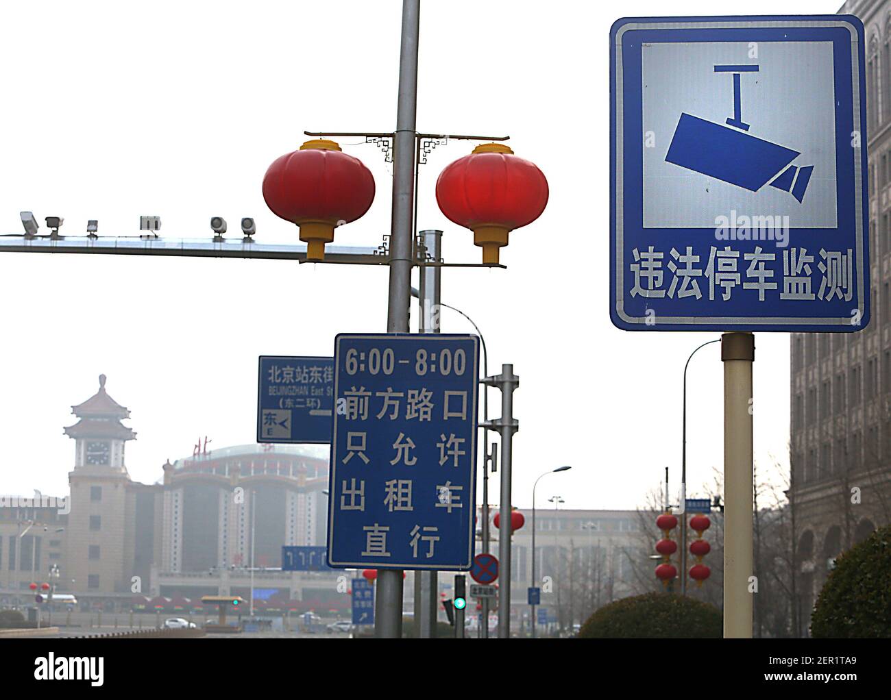 Beijing, China. 28th Feb, 2021. Closed circuit television (CCTV) cameras  watch over an intersection in downtown Beijing on Sunday, February 28,  2021. Chinese scientists have developed a 500 megapixel facial recognition  camera