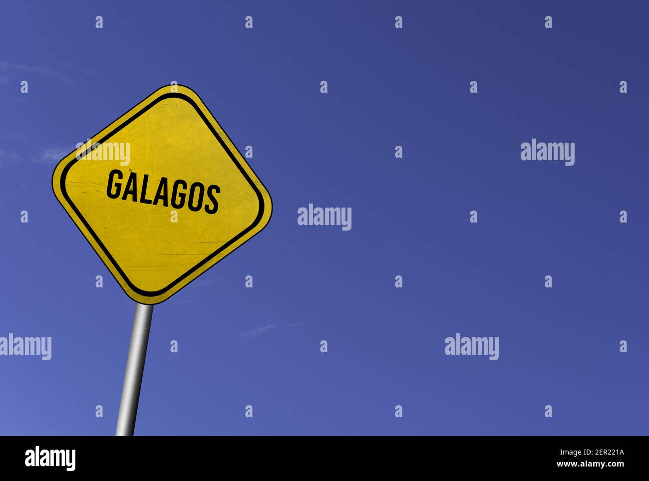 galagos - yellow sign with blue sky background Stock Photo