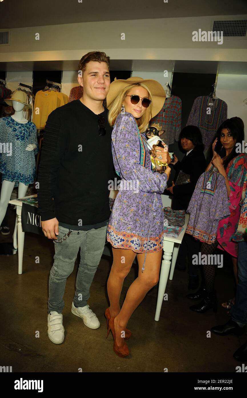 Kitross Chris Zylka, Paris Hilton arrives to the launch of Nicky Hilton's ...