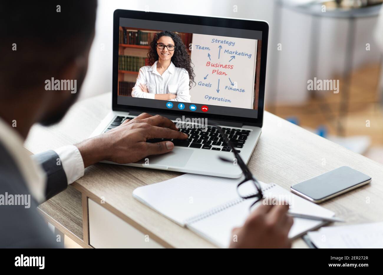 Black businessman working using laptop on his workplace, having training Stock Photo