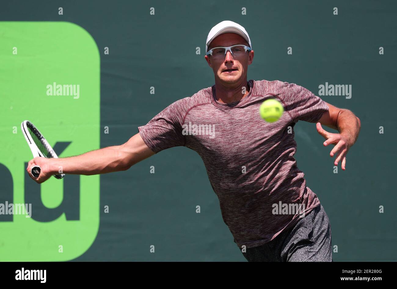 March 19, 2018: Peter Polansky from Canada in action against Reilly Opelka  from the United States of America during a qualifying round at the 2018  Miami Open presented by Itau professional tennis
