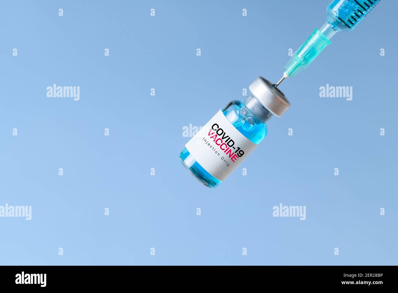 Closed up of Syringe and covid-19 vaccine on blue background,Medical ...