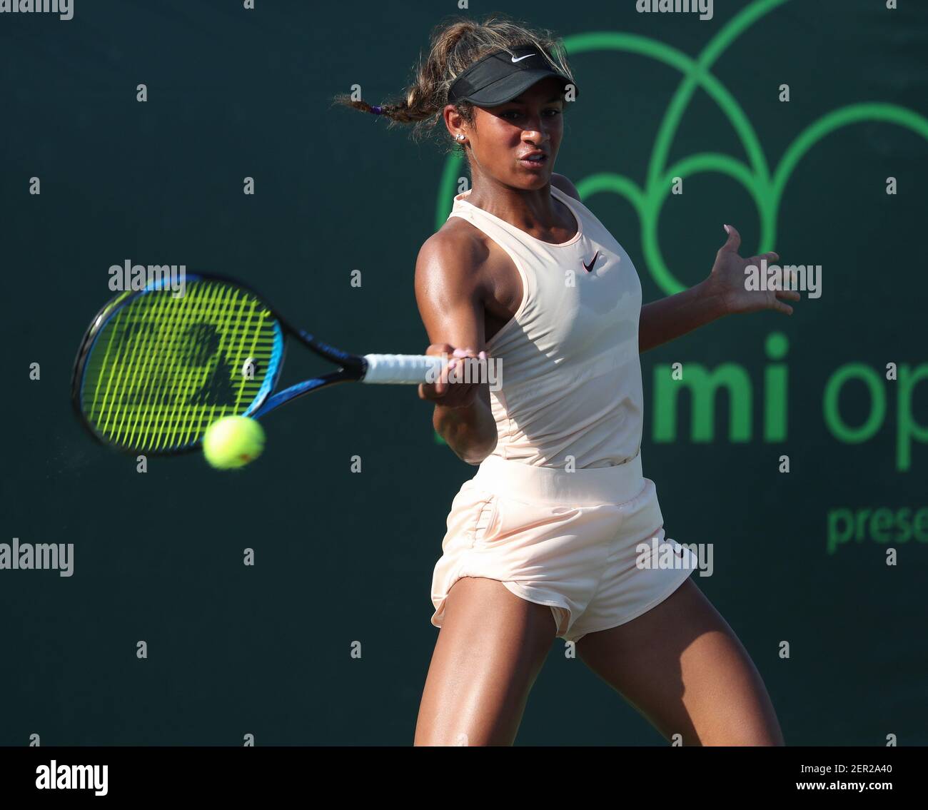 March 20, 2018: Whitney Osuigwe from the United States plays a forehand  against Claire Lui from the United States during a qualifying round at the 2018  Miami Open presented by Itau professional