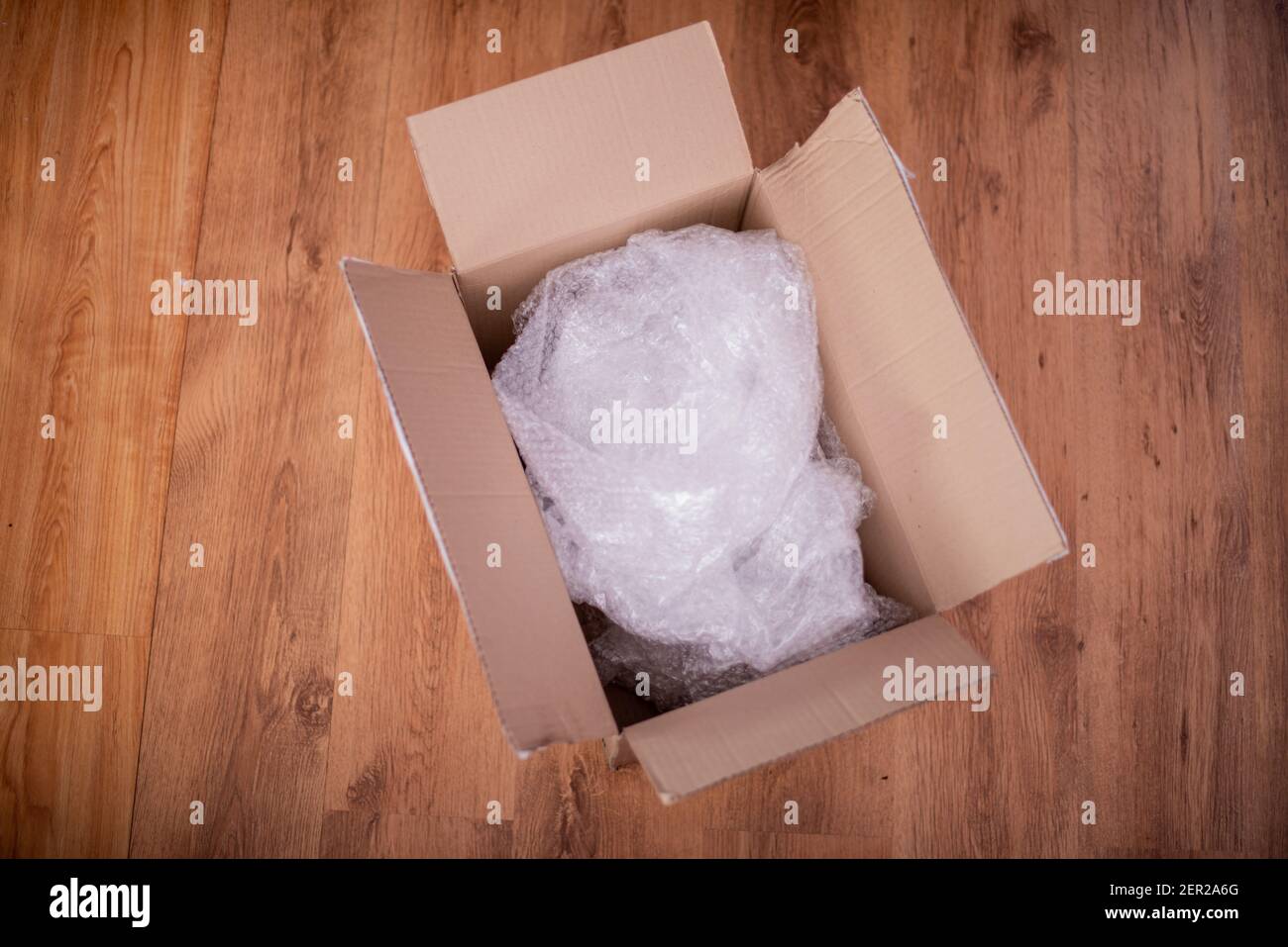High angle view of opened box on floor Stock Photo