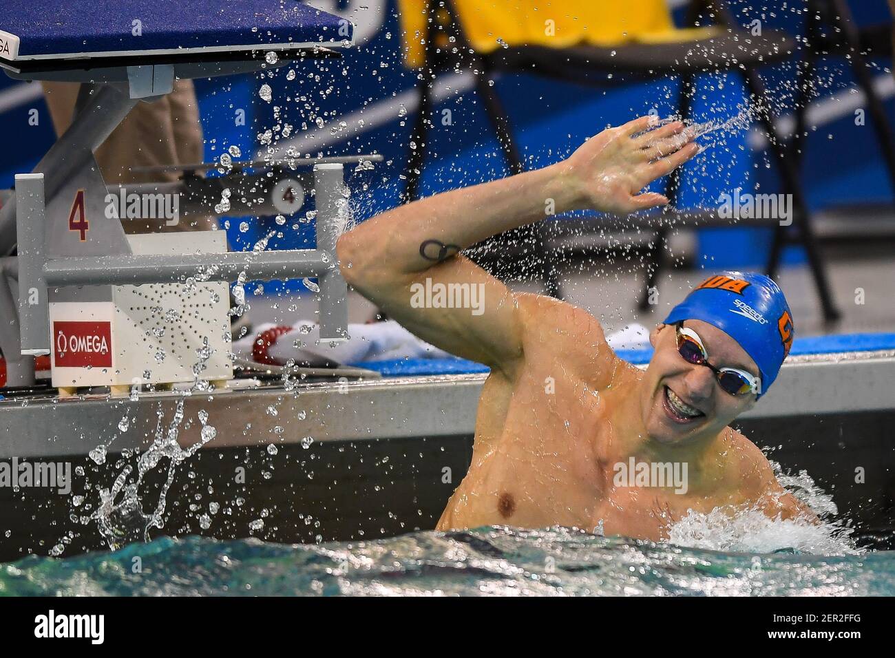 Florida's Caeleb Dressel celebrates his firstplace finish in the men's