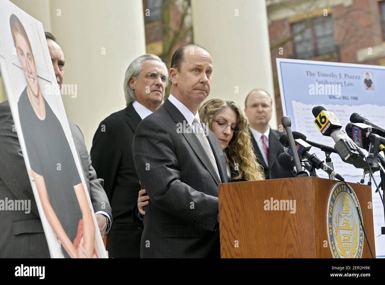 Jim Piazza Speaks About The Importance Of Passing The Anti Hazing Legislation Named After His Son Timothy Piazza As His Wife Evelyn Wraps Her Arm Around Him Outside Of The Centre County Courthouse