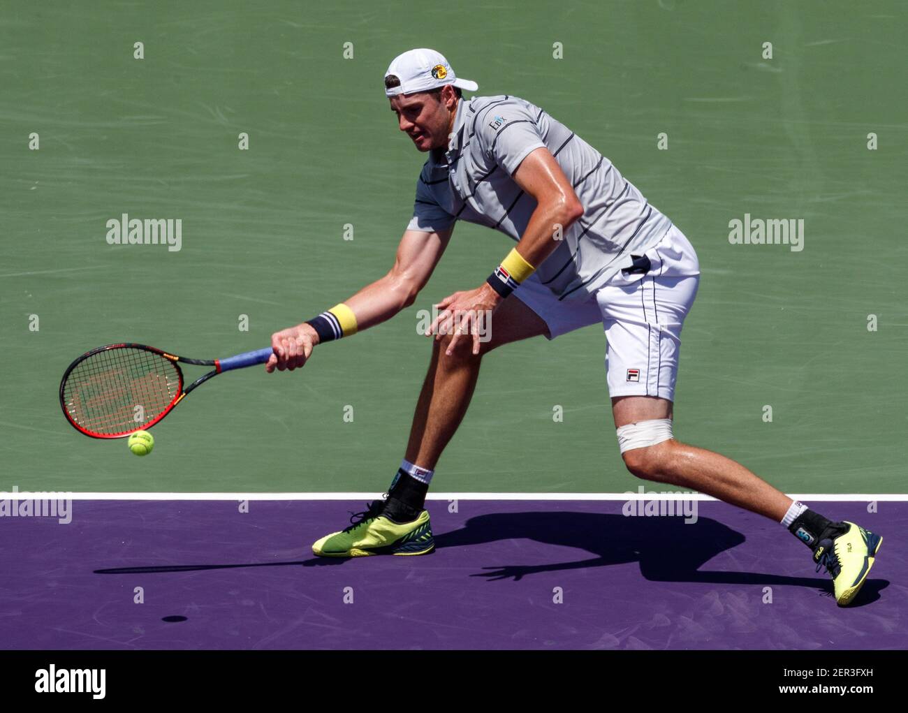 April 01, 2018: John Isner of the United States plays a forehand against  Alexander Zverev of Germany in the men's single championship final of the 2018  Miami Open presented by Itau professional