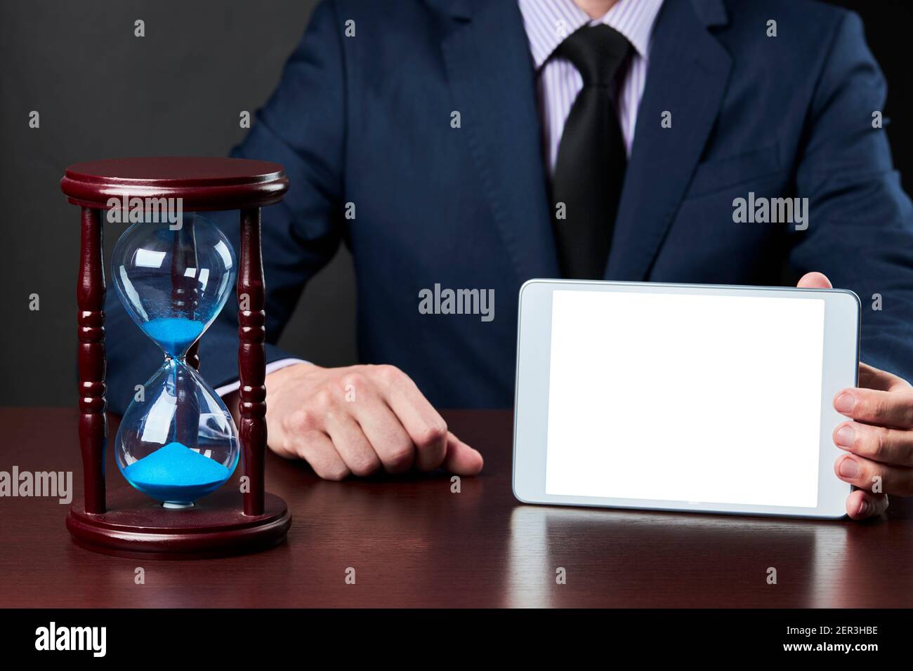 a businessman shows tablet display. business communication technology mockup. template for design Stock Photo