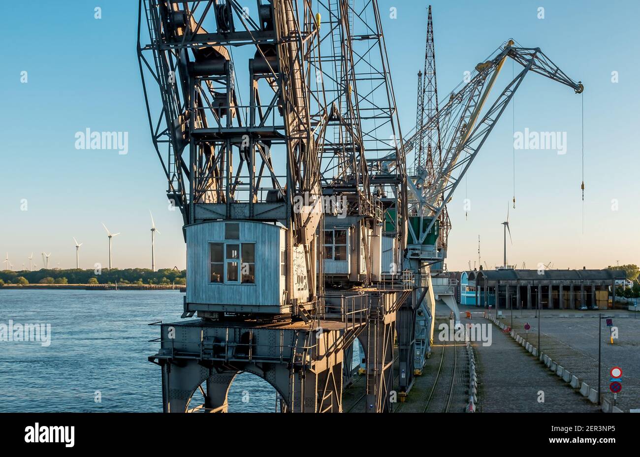 Old harbor cranes in the center of Antwerp. The cranes are part of the collection of the MAS museum. Stock Photo