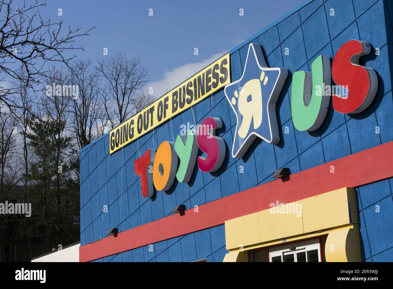 A logo sign outside of a Toys "R" Us retail store in Frederick