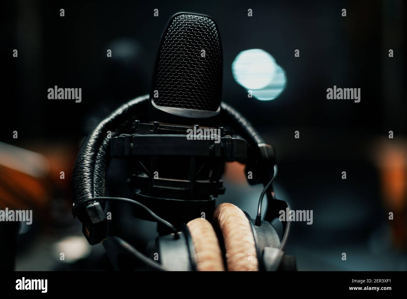 Studio headphones and microphone . Professional recording studio room Stock Photo