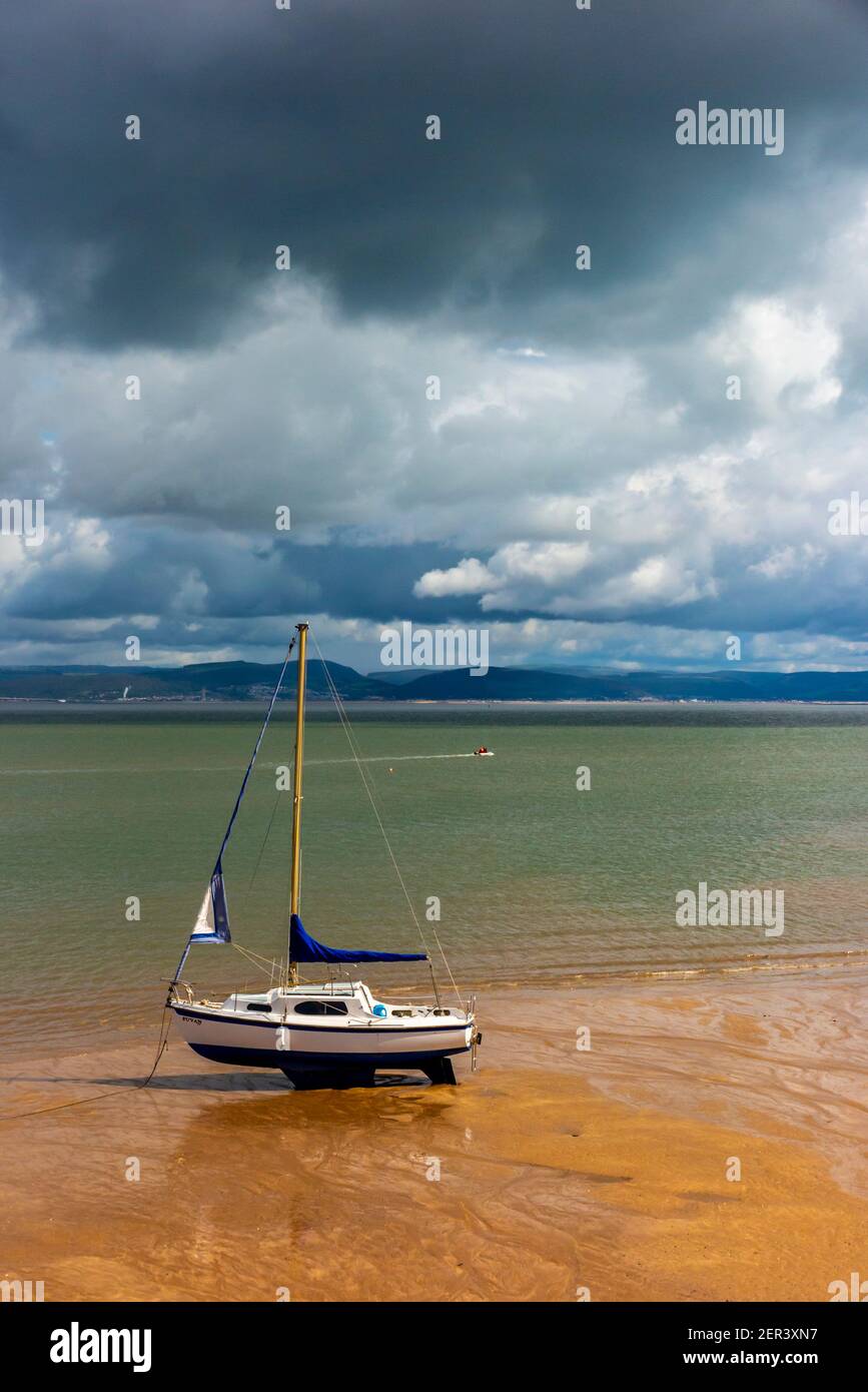 Boats in Swansea Bay seen from Mumbles Beach on the south east coast of the Gower Peninsula near Swansea in South Wales UK Stock Photo
