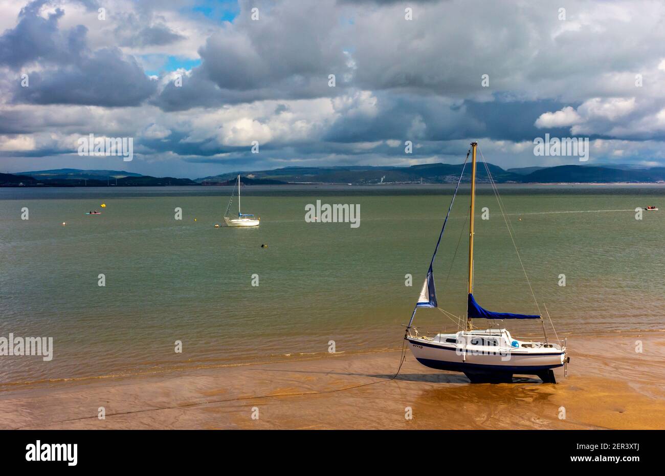 Boats in Swansea Bay seen from Mumbles Beach on the south east coast of the Gower Peninsula near Swansea in South Wales UK Stock Photo