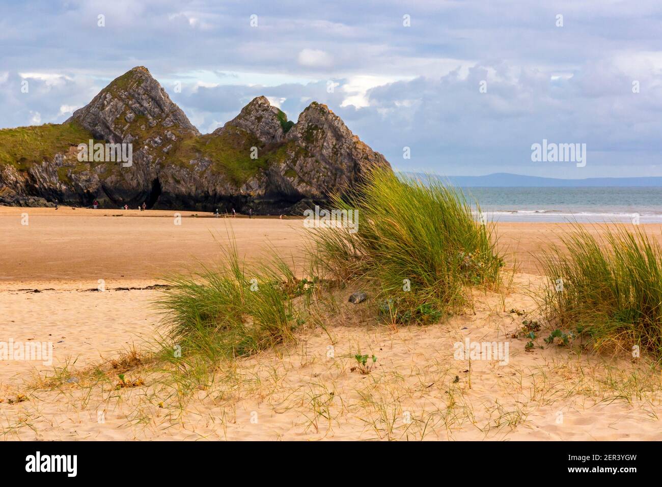 View of the sandy beach and dunes at Three Cliffs Bay on the south coast of the Gower Peninsula near Swansea in South Wales UK Stock Photo