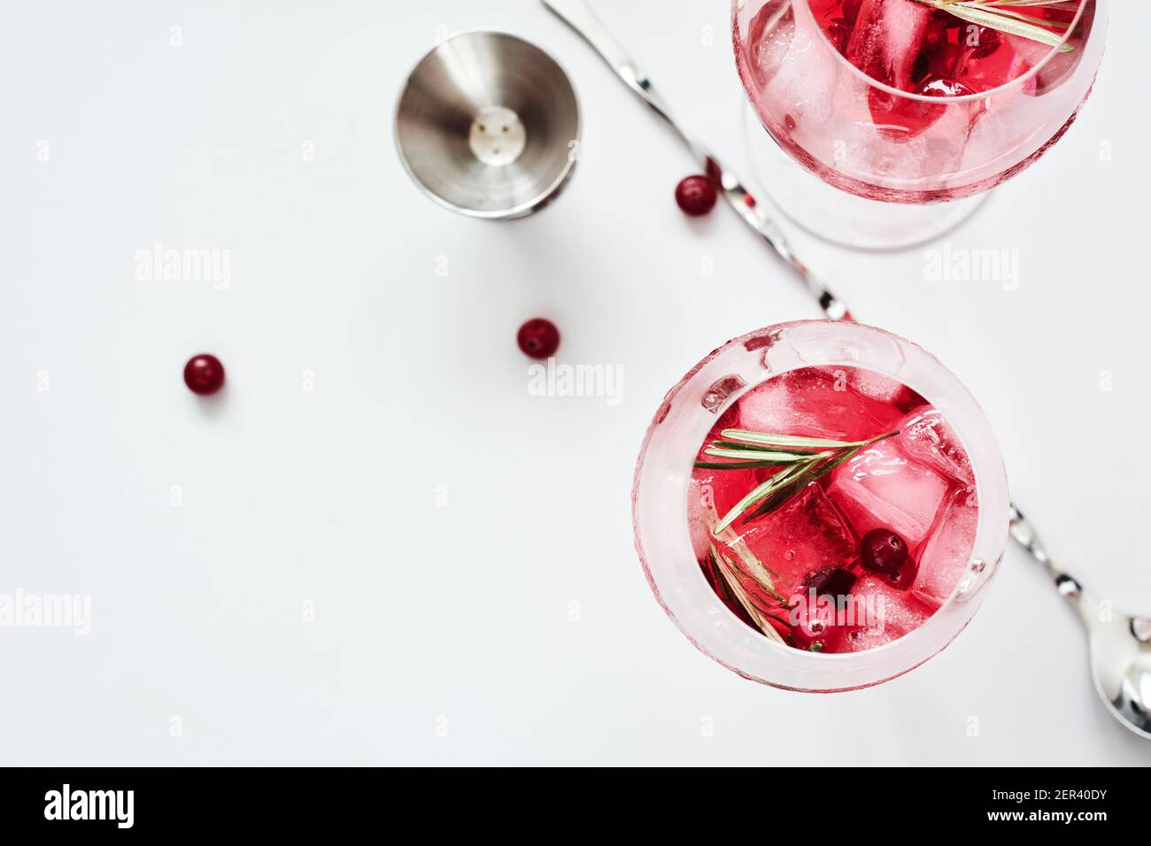 Cranberry rosemary spritzer drink on a light background. Stock Photo