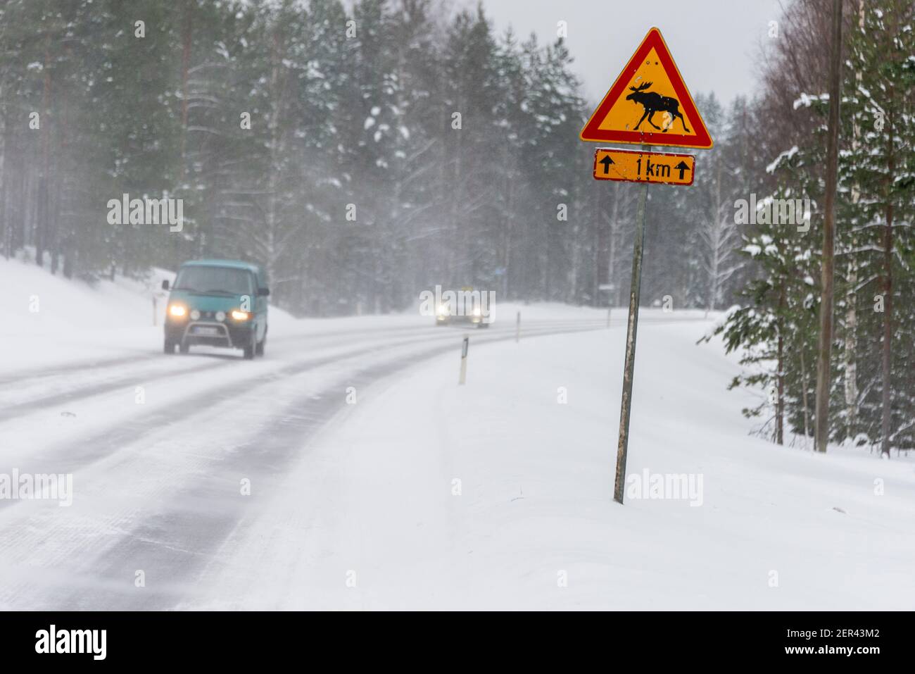 Snow driving on a main road through Moose country in Finland. Stock Photo