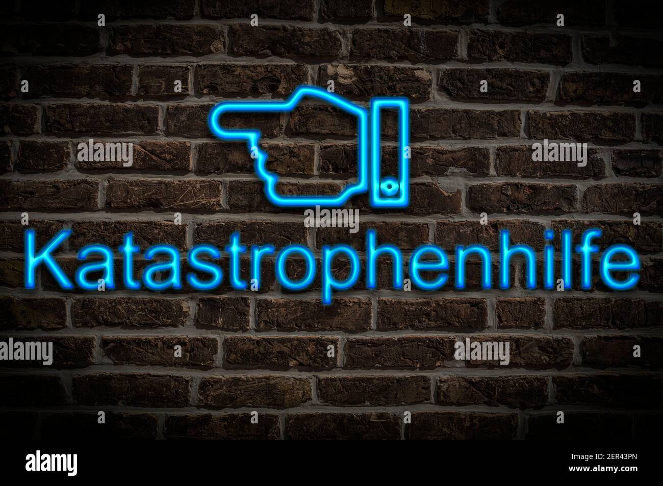 Detail photo of a neon sign on a wall with the inscription Katastrophenhilfe (Emergency relief) Stock Photo