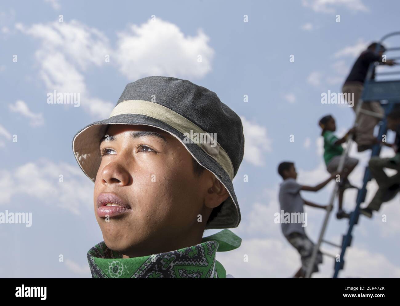 Apr 7, 2018; Puebla, MEXICO; Portrait of Exel Giron,15, from Tegucigalpa Honduras and other Central American migrants outside a church wait for food in Puebla, Mexico for a caravan hoped to travel to the US border drawing the ire of President Donald Trump. Mandatory Credit: Nick Oza/The Arizona Republic via USA TODAY NETWORK/Sipa USA Stock Photo