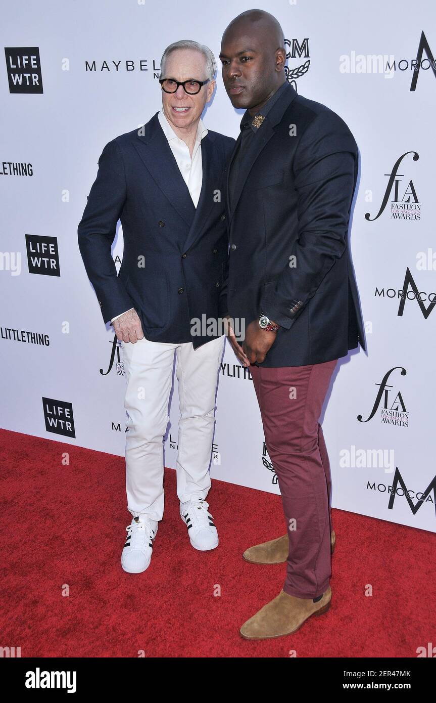 L-R) Tommy Hilfiger and Corey Gamble at the Daily Front Row's 4th Annual  Fashion Los Angeles Awards held at The Beverly Hills Hotel, Crystal Gardens  in Beverly Hills, CA on Sunday, April
