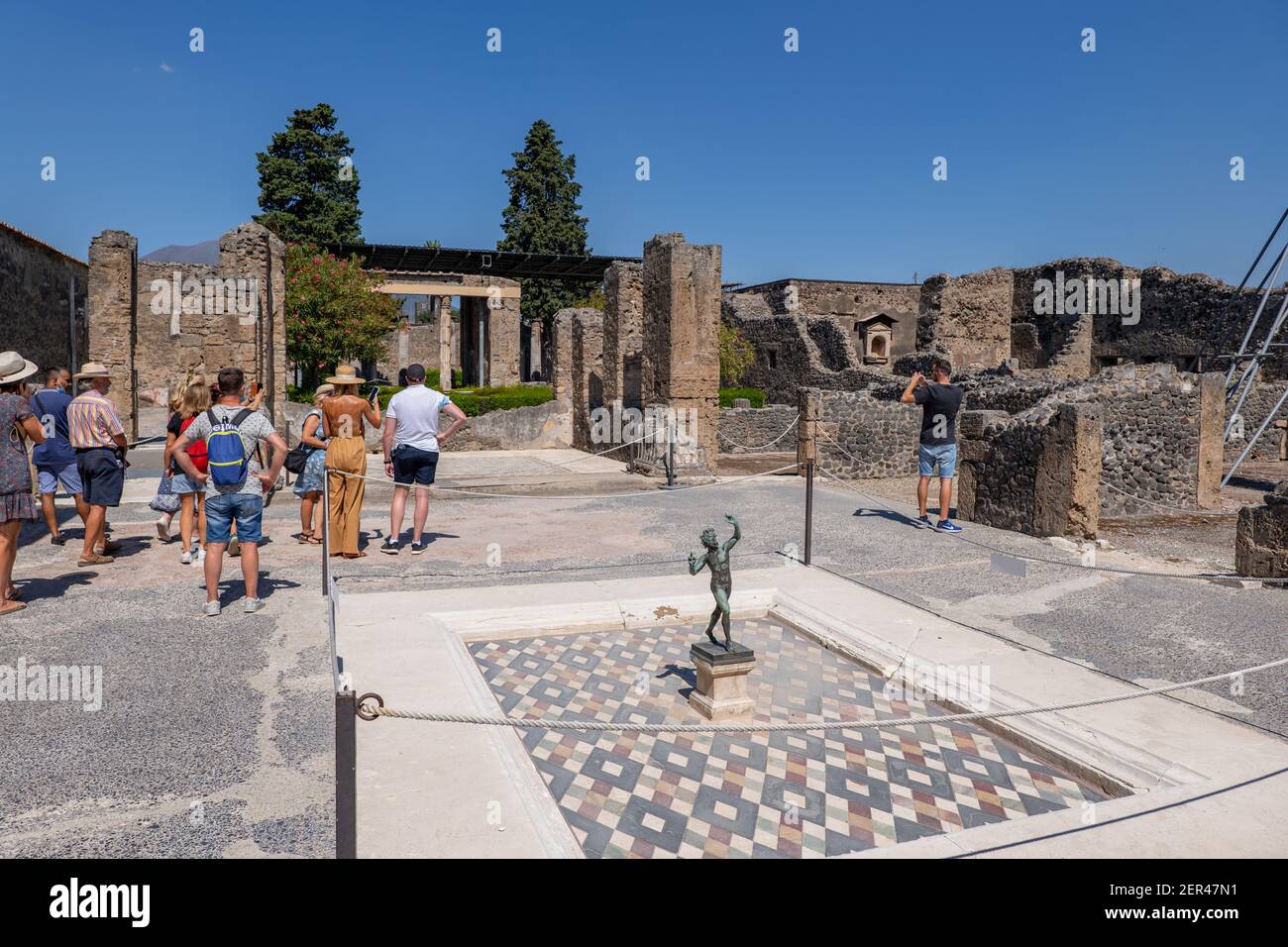 House of the Faun (Italian: Casa del Fauno) from 2nd century BC with dancing faun sculpture in impluvium, ancient Pompeii, Pompei, Italy Stock Photo