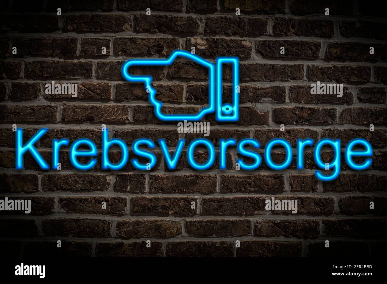 Detail photo of a neon sign on a wall with the inscription Krebsvorsorge (Cancer Prevention) Stock Photo