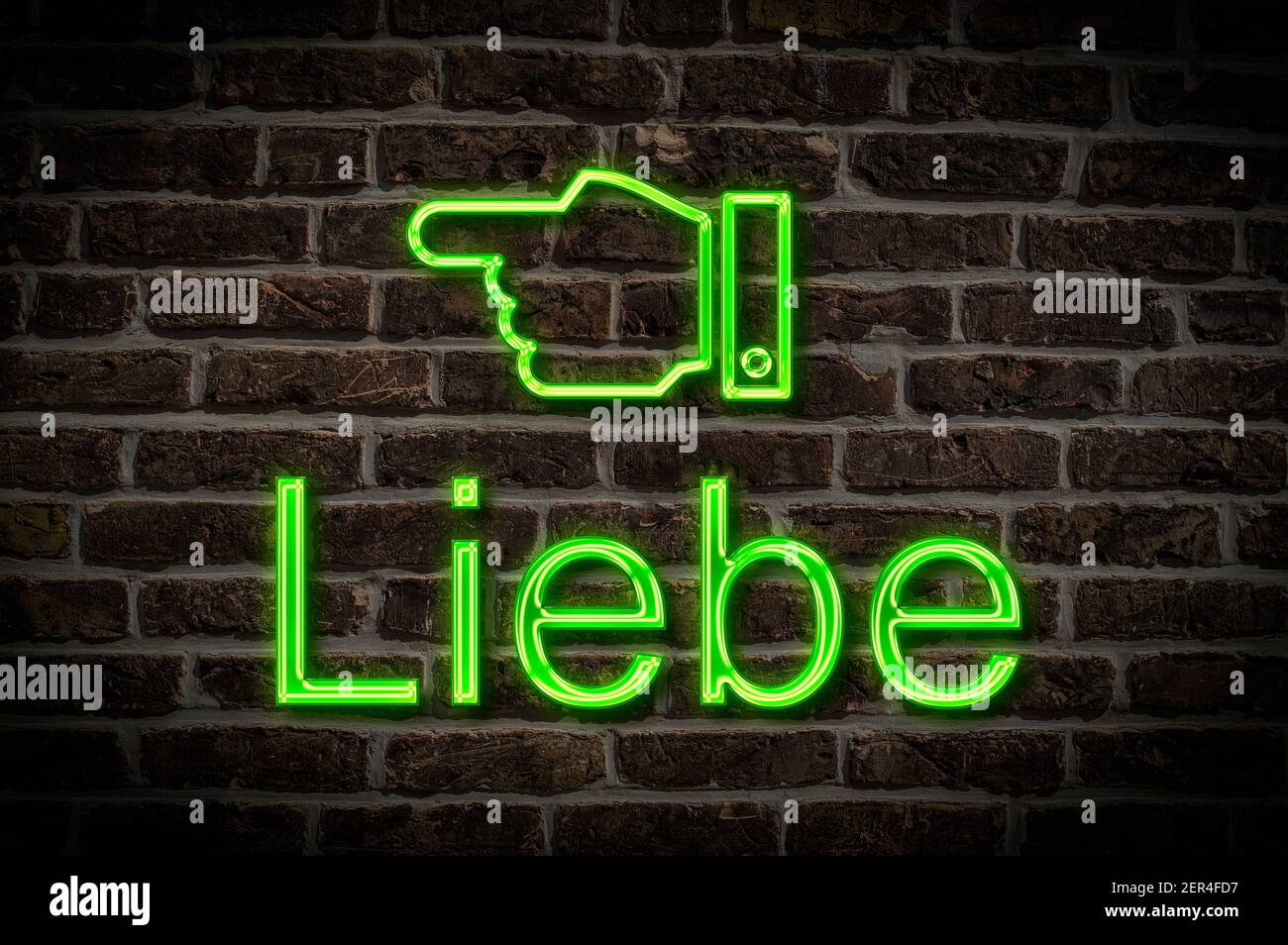 Detail photo of a neon sign on a wall with the inscription Liebe (Love) Stock Photo