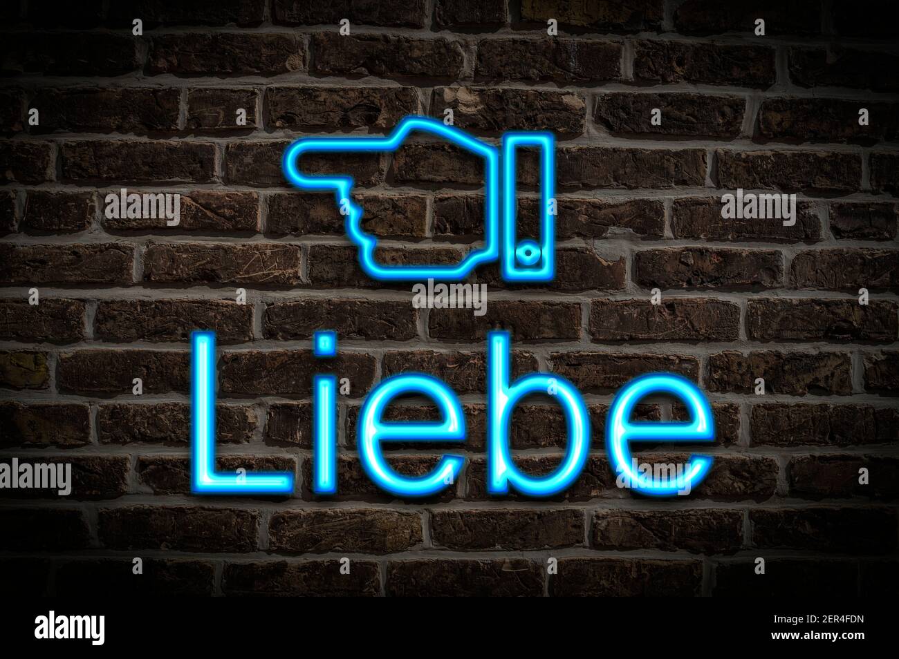 Detail photo of a neon sign on a wall with the inscription Liebe (Love) Stock Photo