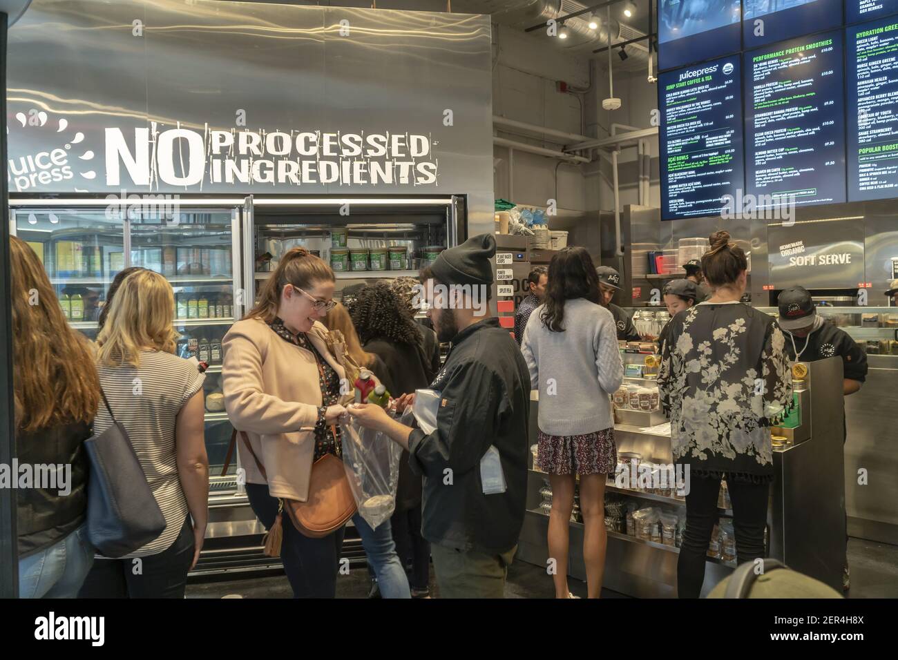 Hordes of millennials crowd the new Juice Press grand opening