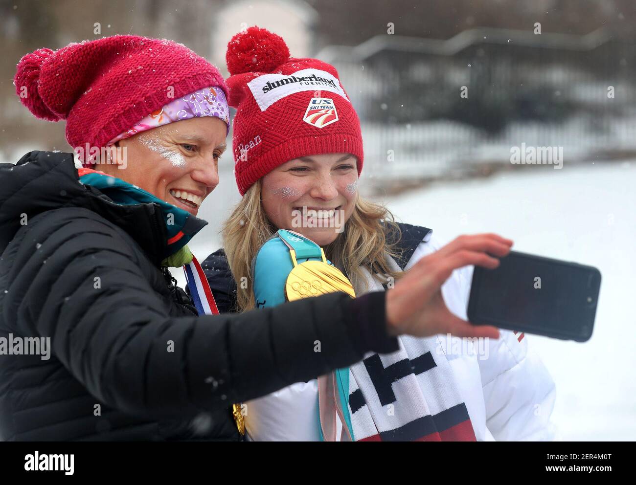 Jessie Diggins, Team USA Olympic gold medalist cross country skier, poses for a selfie with Kris Hansen, her high school coach, as hundreds brave snowy, blustery weather to honor Diggins with a parade on Saturday, April 14, 2018, in Stillwater, Minn. (Photo by David Joles/Minneapolis Star Tribune/TNS/Sipa USA) Stock Photo