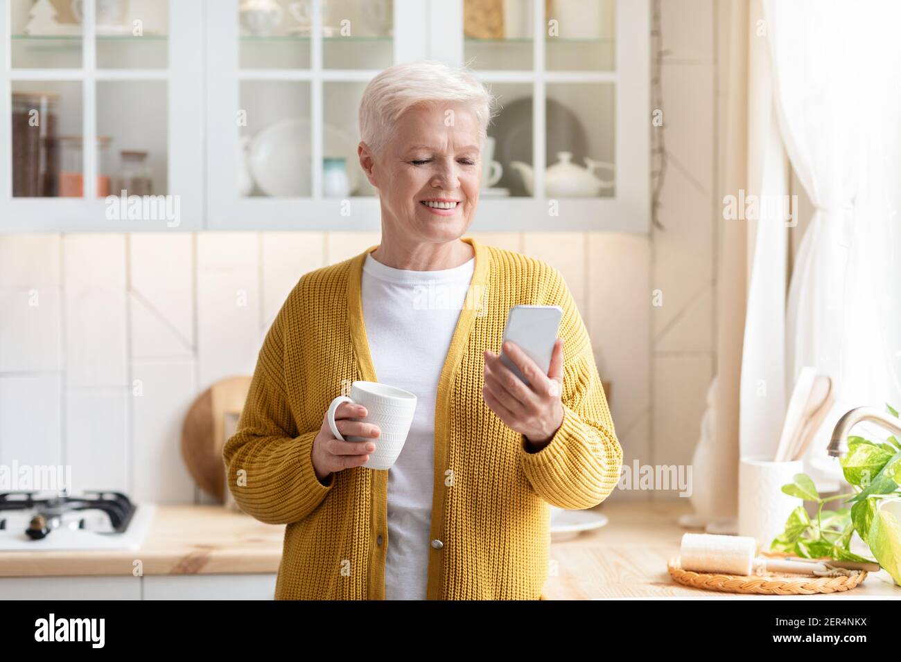 Old lady drinking tea hi-res stock photography and images - Alamy