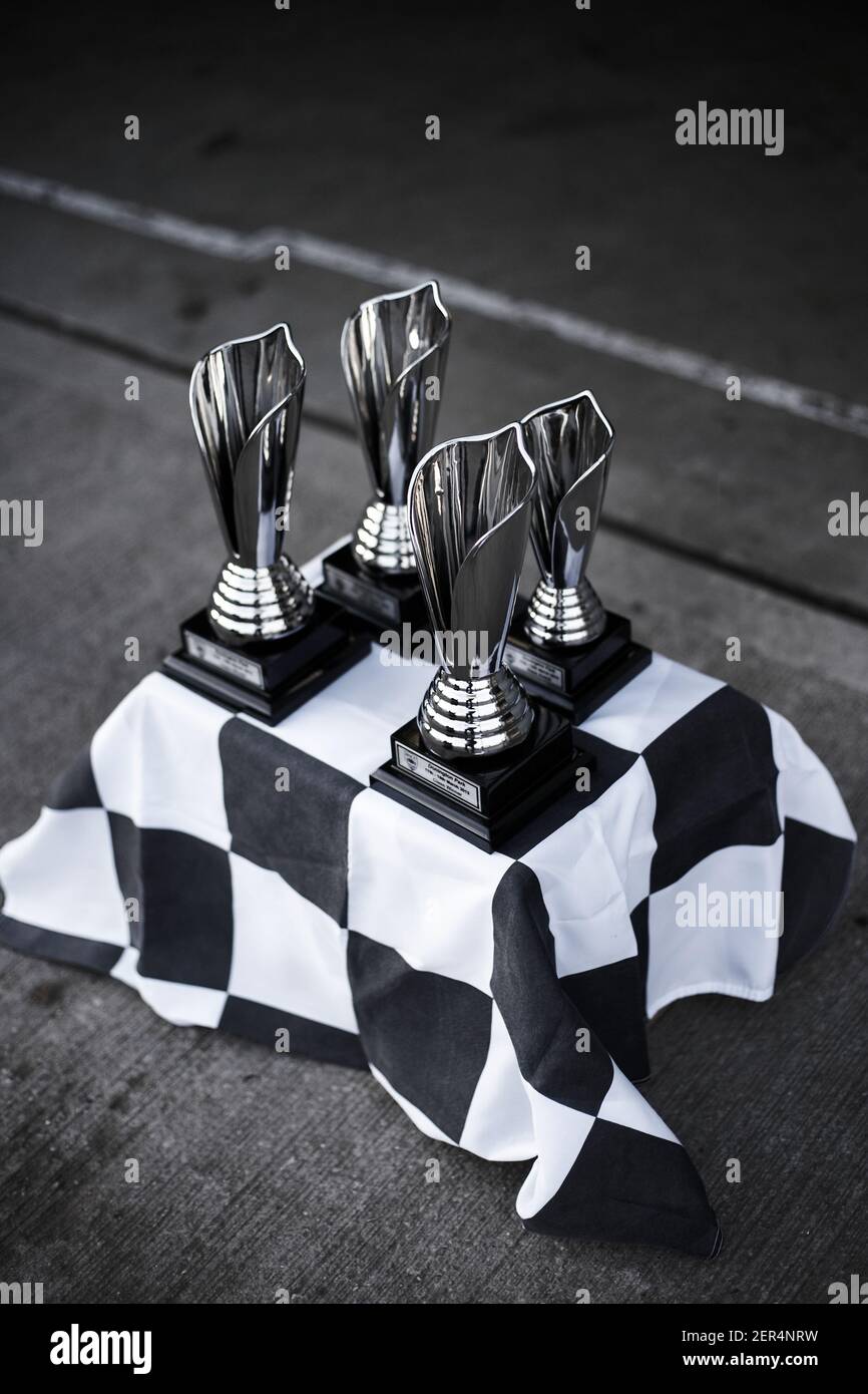Trophy cups standing on checkered Flat Stock Photo
