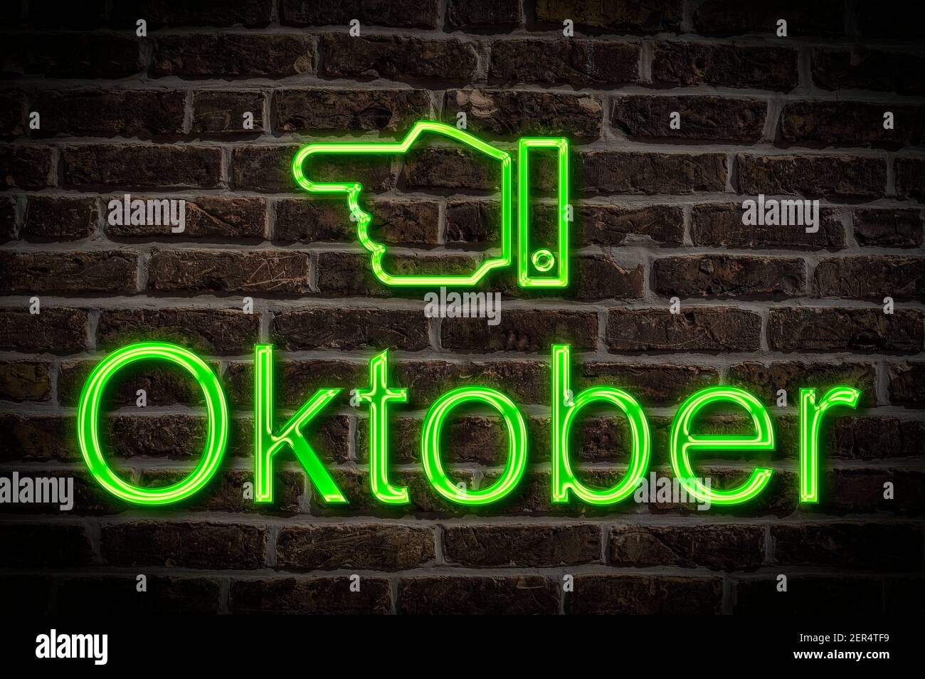 Detail photo of a neon sign on a wall with the inscription Oktober (October) Stock Photo