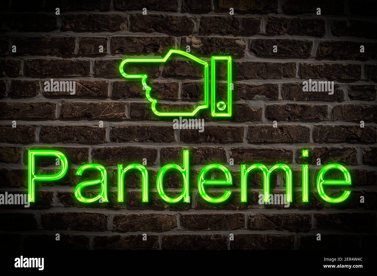 Detail photo of a neon sign on a wall with the inscription Pandemie (pandemic) Stock Photo