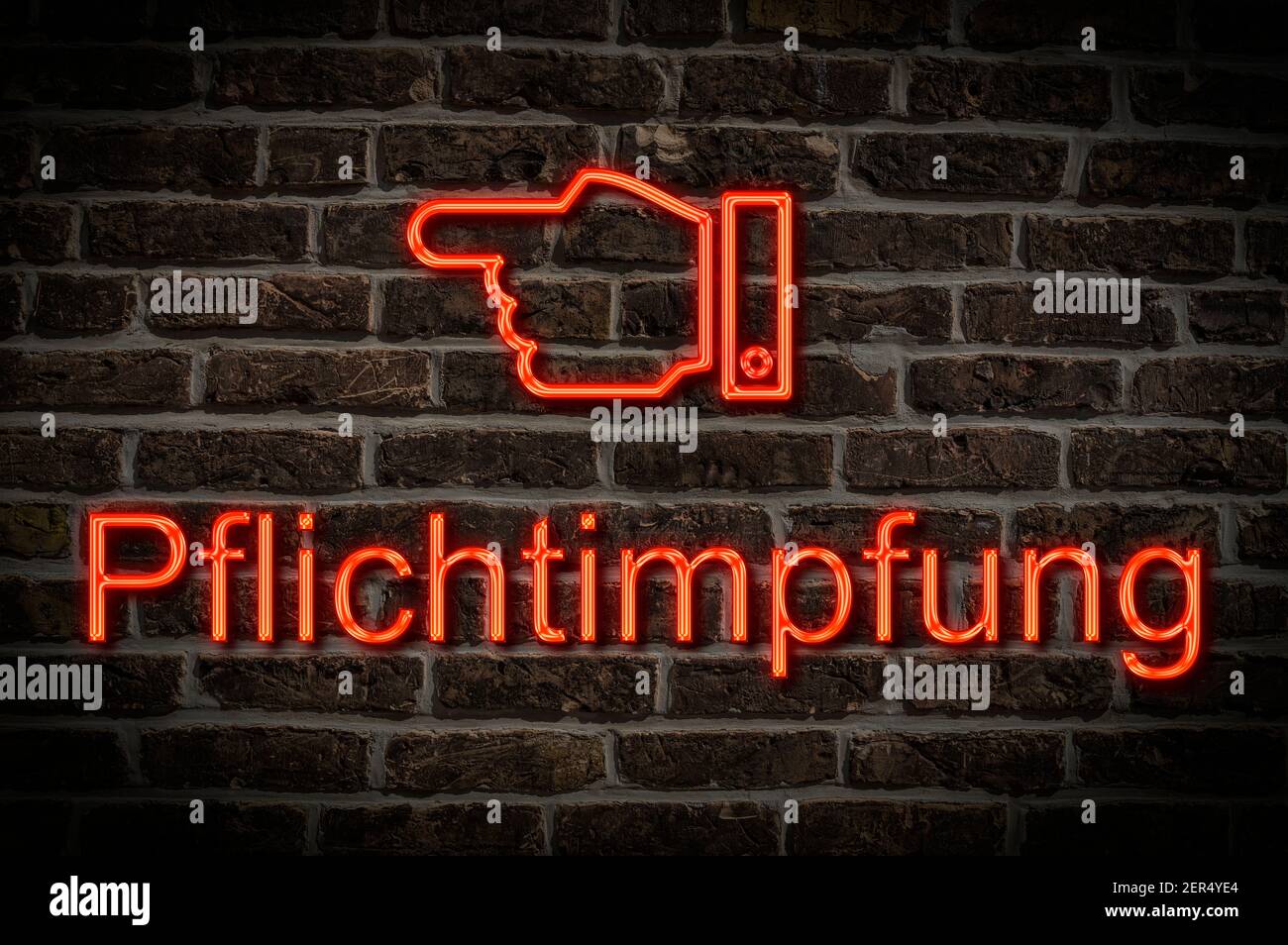 Detail photo of a neon sign on a wall with the inscription Pflichtimpfung (compulsory vaccination) Stock Photo