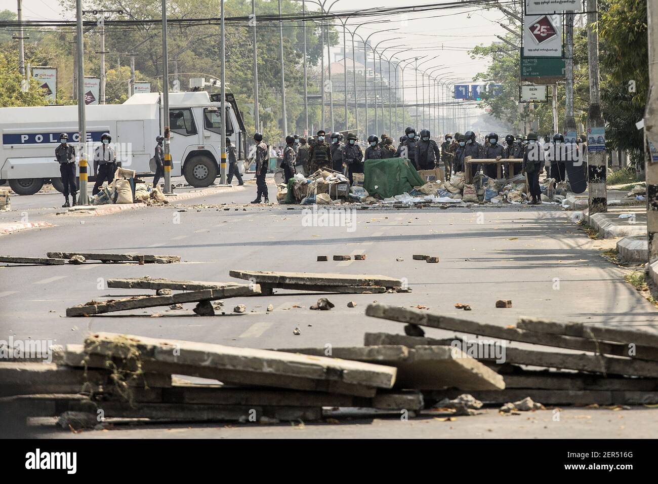 Mandalay, Myanmar. 28th Feb, 2021. Riot police clear a barricade to move forward during a protest against the military coup in Mandalay, Myanmar on Sunday, February 28, 2021. Security forces continue to crackdown on demonstrations against the military coup. Photo by Xiao Long/UPI Credit: UPI/Alamy Live News Stock Photo