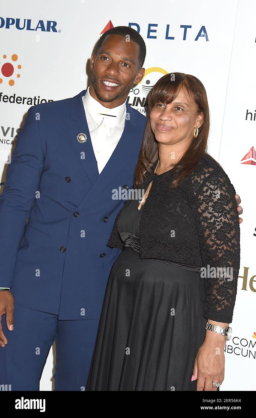 Victor Cruz and his mother Blanca Cruz attend the Hispanic Federaton's