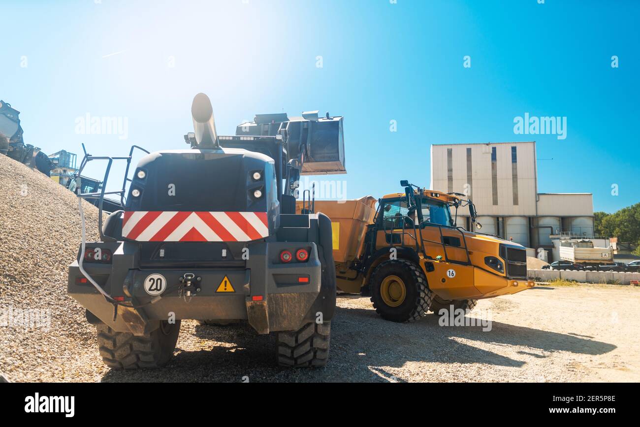 Heavy wheel loader in quarry waiting for work Stock Photo