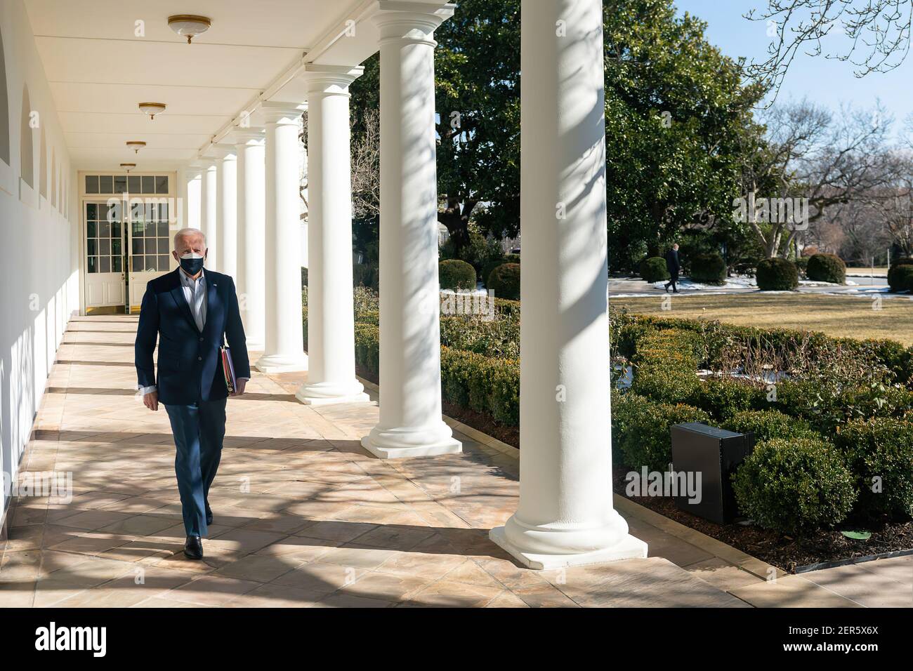President Joe Biden arrives to the Oval Office Saturday, Feb. 20, 2021, along the West Wing Colonnade of the White House. (Official White House Photo by Adam Schultz) Stock Photo