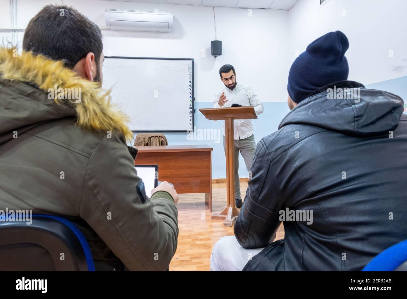 Doctor at university explaining stuff to students Stock Photo