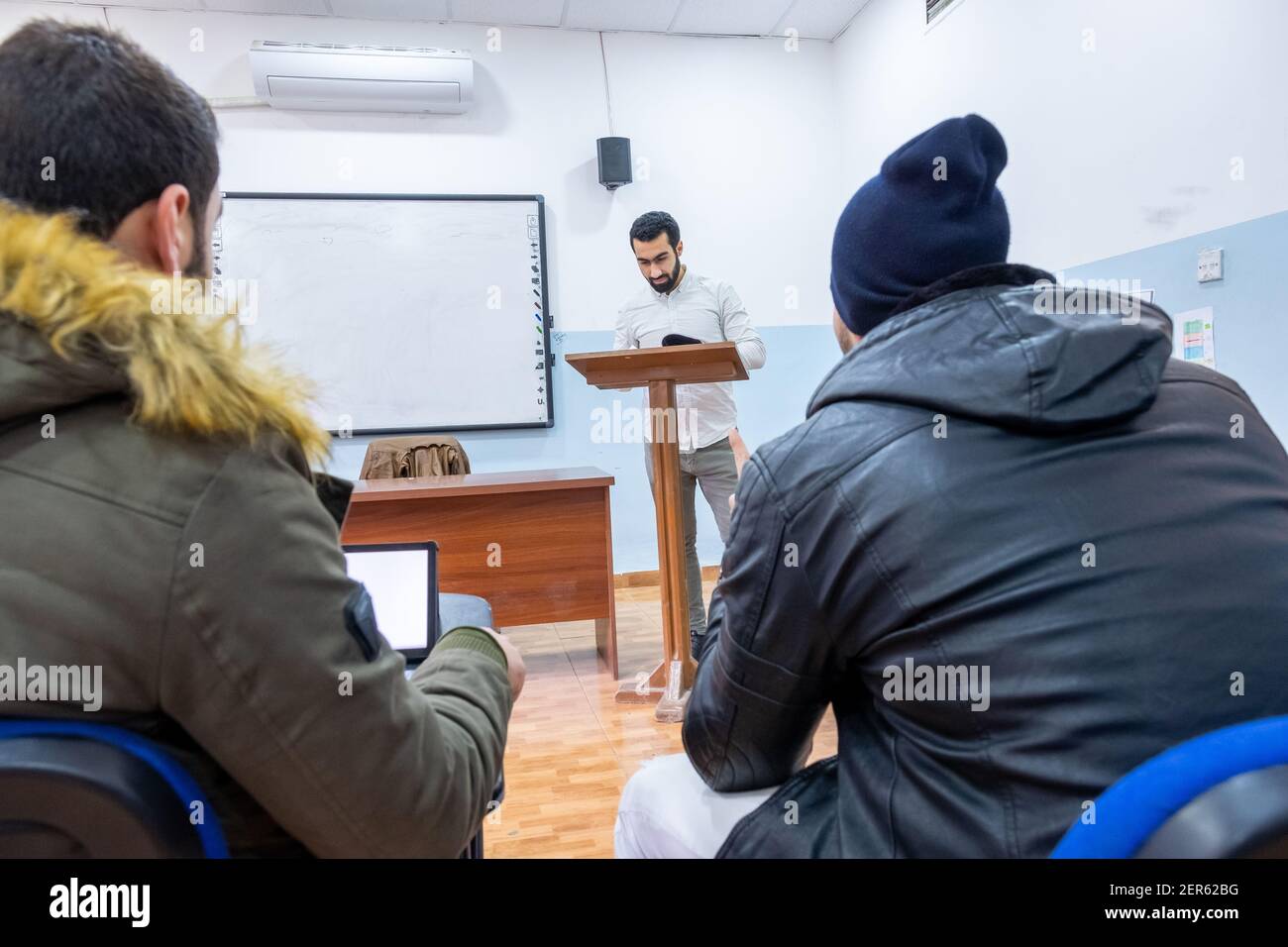 Doctor at university explaining stuff to students Stock Photo